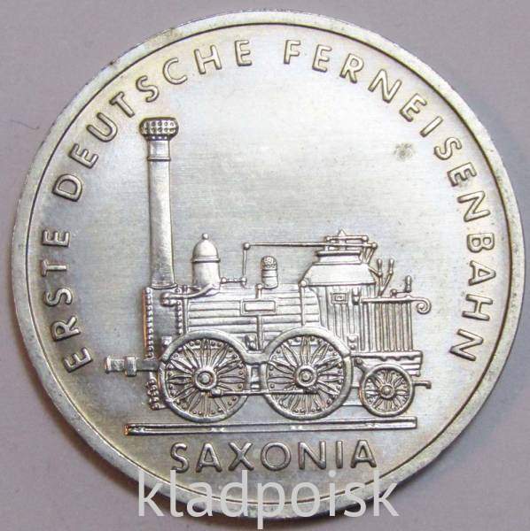 Монета ГДР 5 марок 1988 года Первый немецкий паровоз Саксония Монета ГДР 5 марок 1988 года Первый немецкий паровоз Саксония