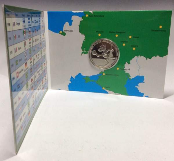 Монета 100 франков Буркина Фасо в оригинальном буклете ЧМ по футболу 2018 года. Талисман чемпионата «Волк Забивака»