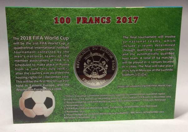 Монета 100 франков Буркина Фасо в оригинальном буклете ЧМ по футболу 2018 года. Талисман чемпионата «Волк Забивака»